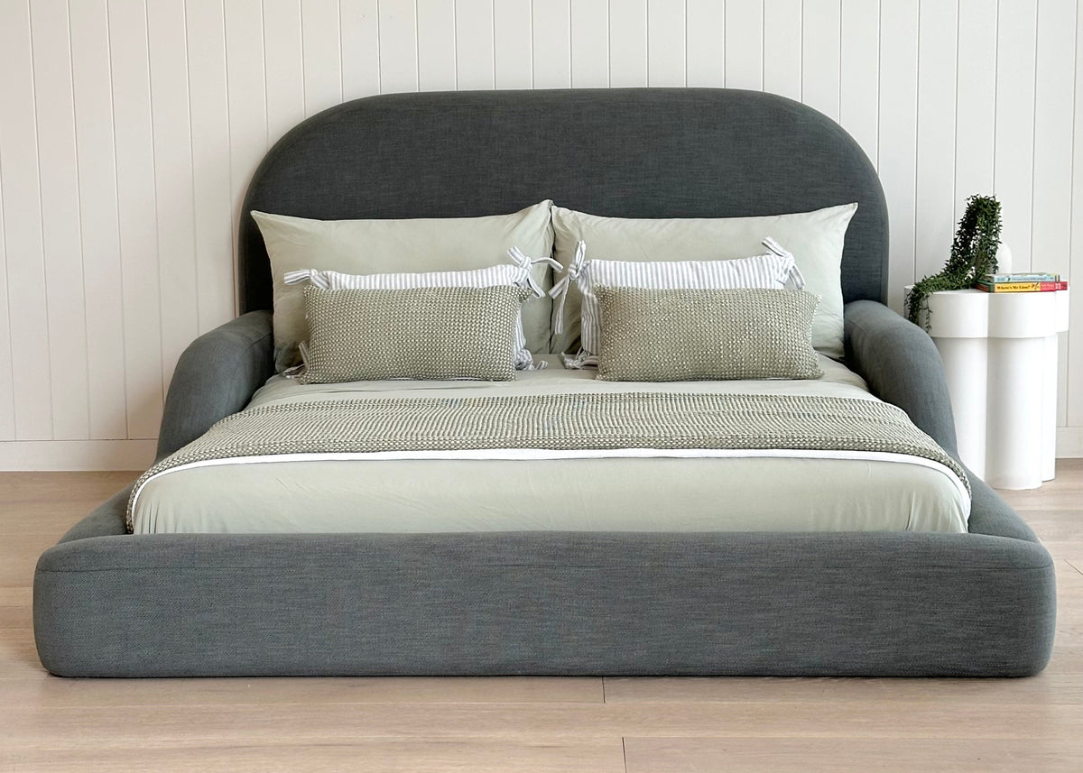 Tulum Kids Bed in dark green upholstery with rounded, cushioned frame by Kamari Furniture