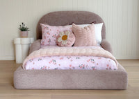 Curved silhouette of the Tulum Bed adding a modern touch to a child’s bedroom