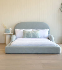 Blue kids bed with guards rails