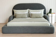 Tulum Kids Bed in dark green upholstery with rounded, cushioned frame by Kamari Furniture