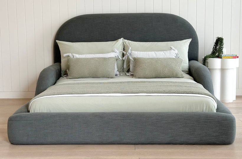 Tulum Kids Bed in dark green upholstery with rounded, cushioned frame by Kamari Furniture