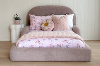 Curved silhouette of the Tulum Bed adding a modern touch to a child’s bedroom