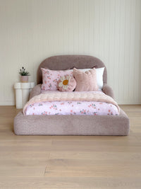 Curved silhouette of the Tulum Bed adding a modern touch to a child’s bedroom