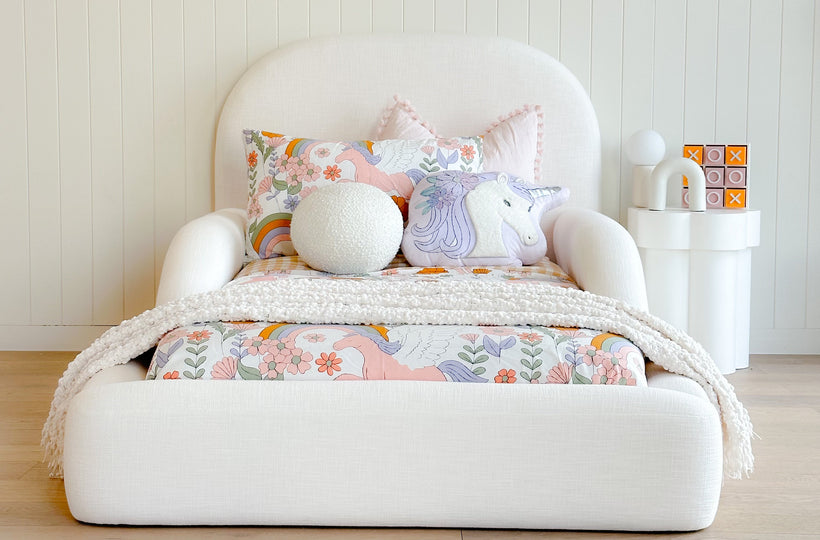 Tulum Kids Bed in white upholstery with rounded, cushioned frame by Kamari Furniture