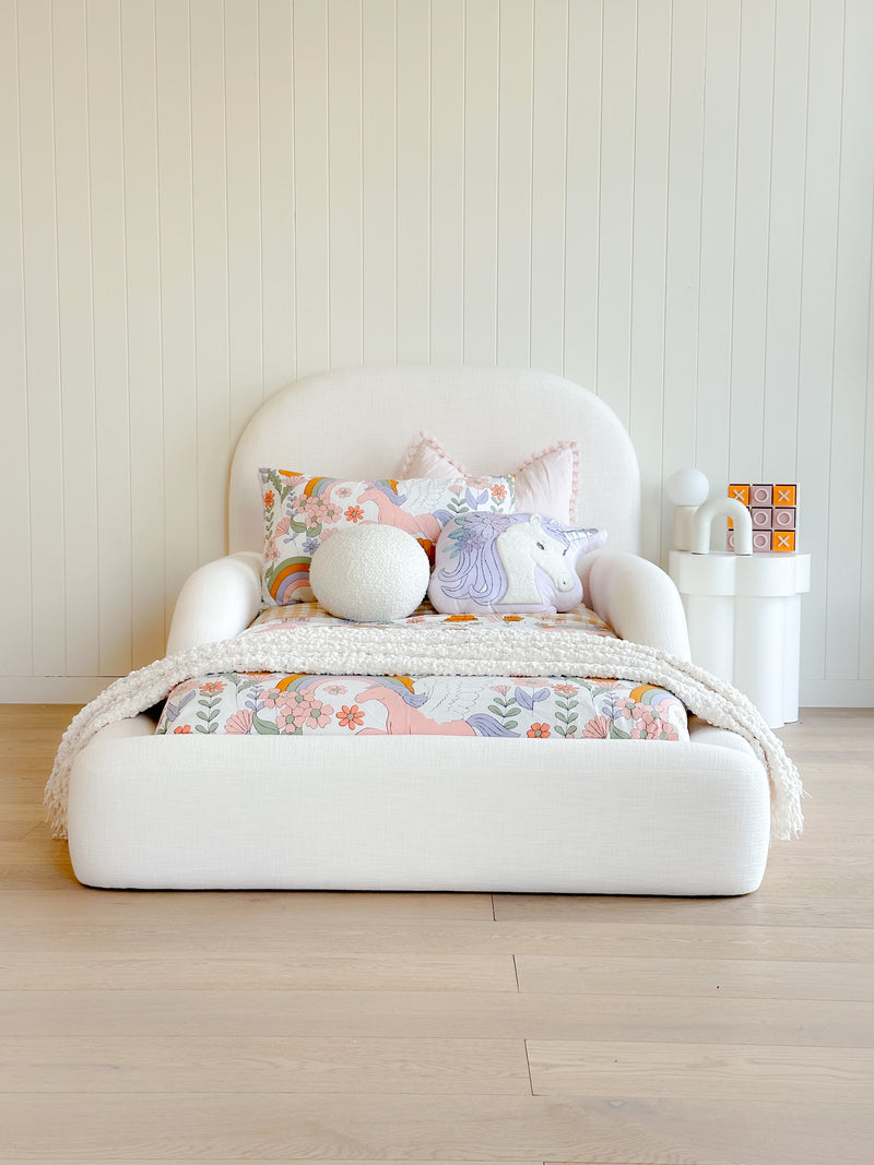 Tulum Kids Bed in white upholstery with rounded, cushioned frame by Kamari Furniture